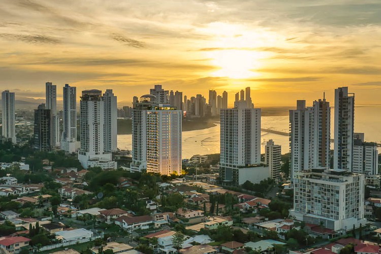 A view of the buildings in Coca del Mar at sunset.