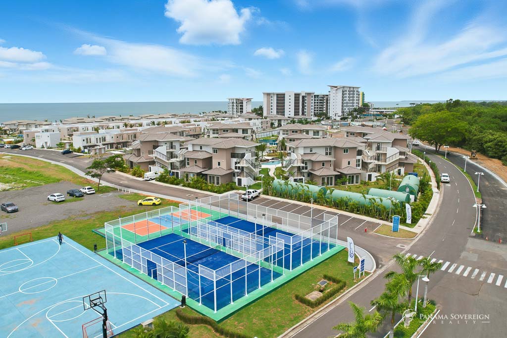 Wide shot capturing the entire development layout with mountain views beyond the property.