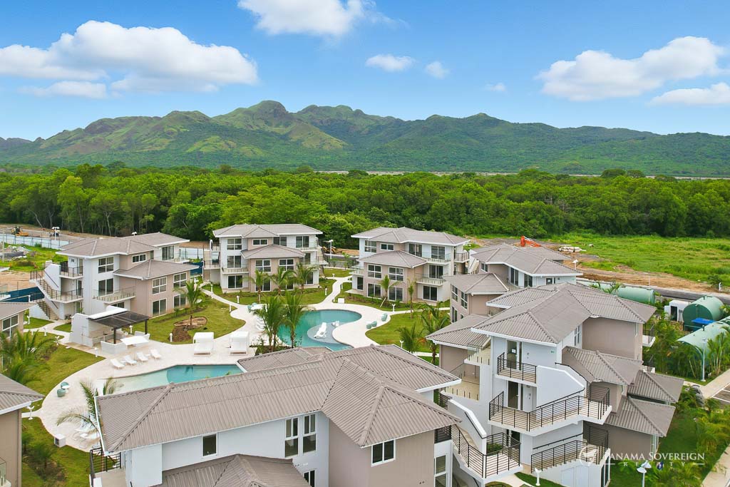 Another view of the community with surrounding nature and forested mountain ranges.