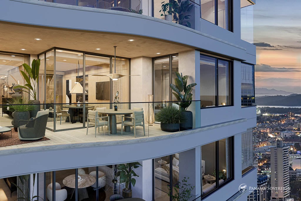 Large glass-walled balcony with seating and dining areas, offering panoramic ocean views in an upscale Costa del Este residence.