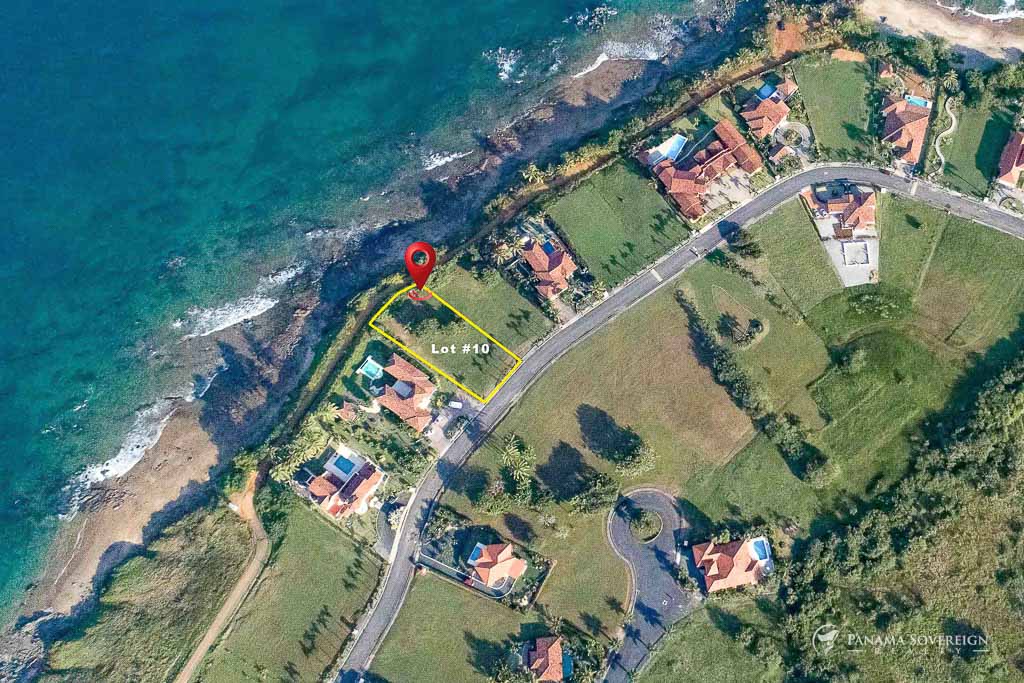 Bird’s-eye perspective of Lot #10, a prime beachfront lot outlined in yellow, with direct access to the Pacific Ocean and a scenic coastal backdrop.