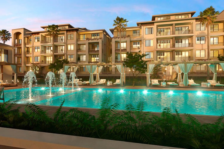 A luxury condo building with a fountain pool in Panama.