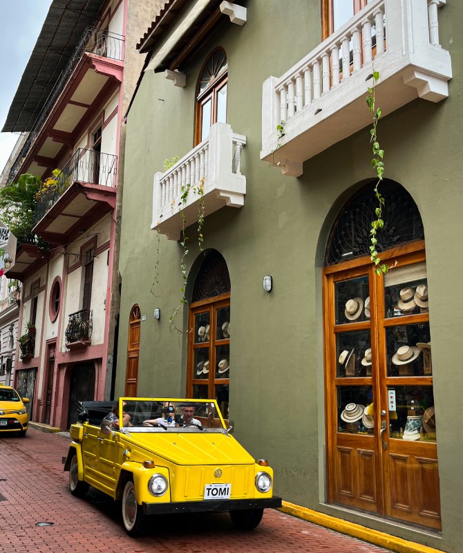 Property Buyers & Sellers A yellow car driving in Casco Viejo.